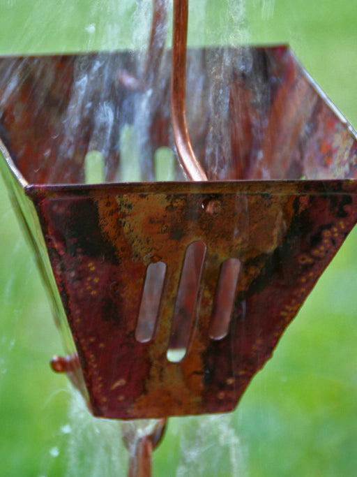 Slotted square pre-aged copper rain chain for heavy rain in Hawaii
