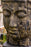 large buddha head cast concrete statue black wood texture gold gilt
