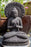 seated concrete buddha black finish praying mudras halo full lotus