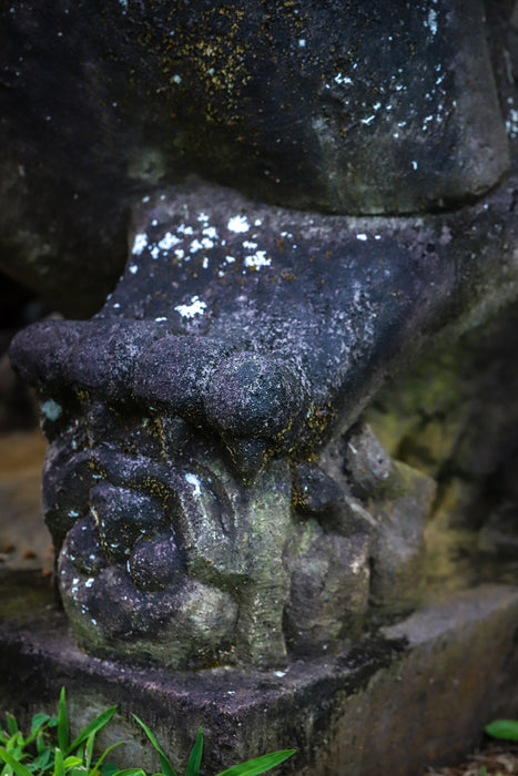 Large hand carved lava rock fu dog female paw weathered aged stone yard statue