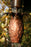 Hand-tooled pineapple cup detail on pure copper rain chain